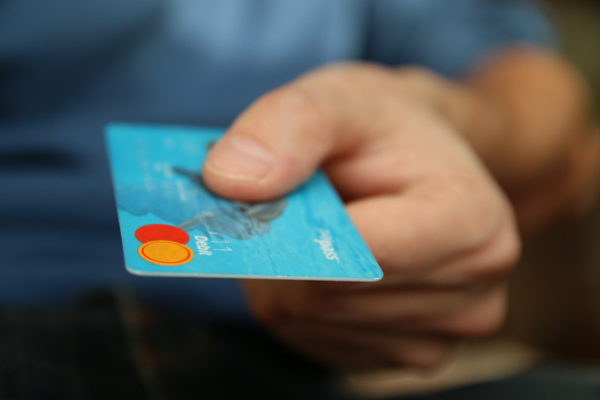 Man holding a credit card.